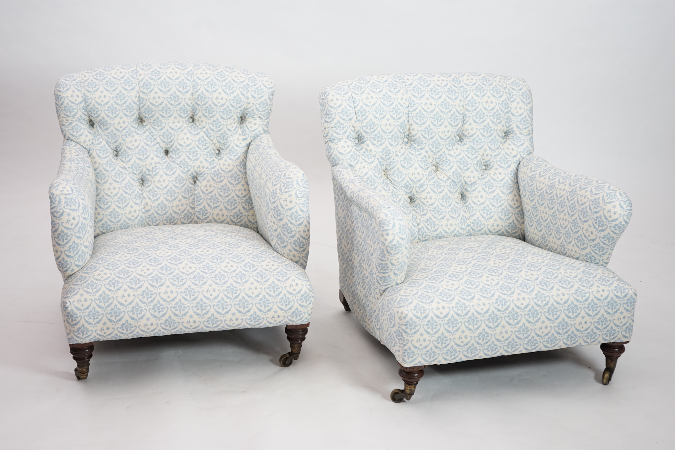 A Victorian Howard & Sons Bridgewater armchair and a similar Victorian armchair